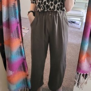 Long, wide-legged green pants.